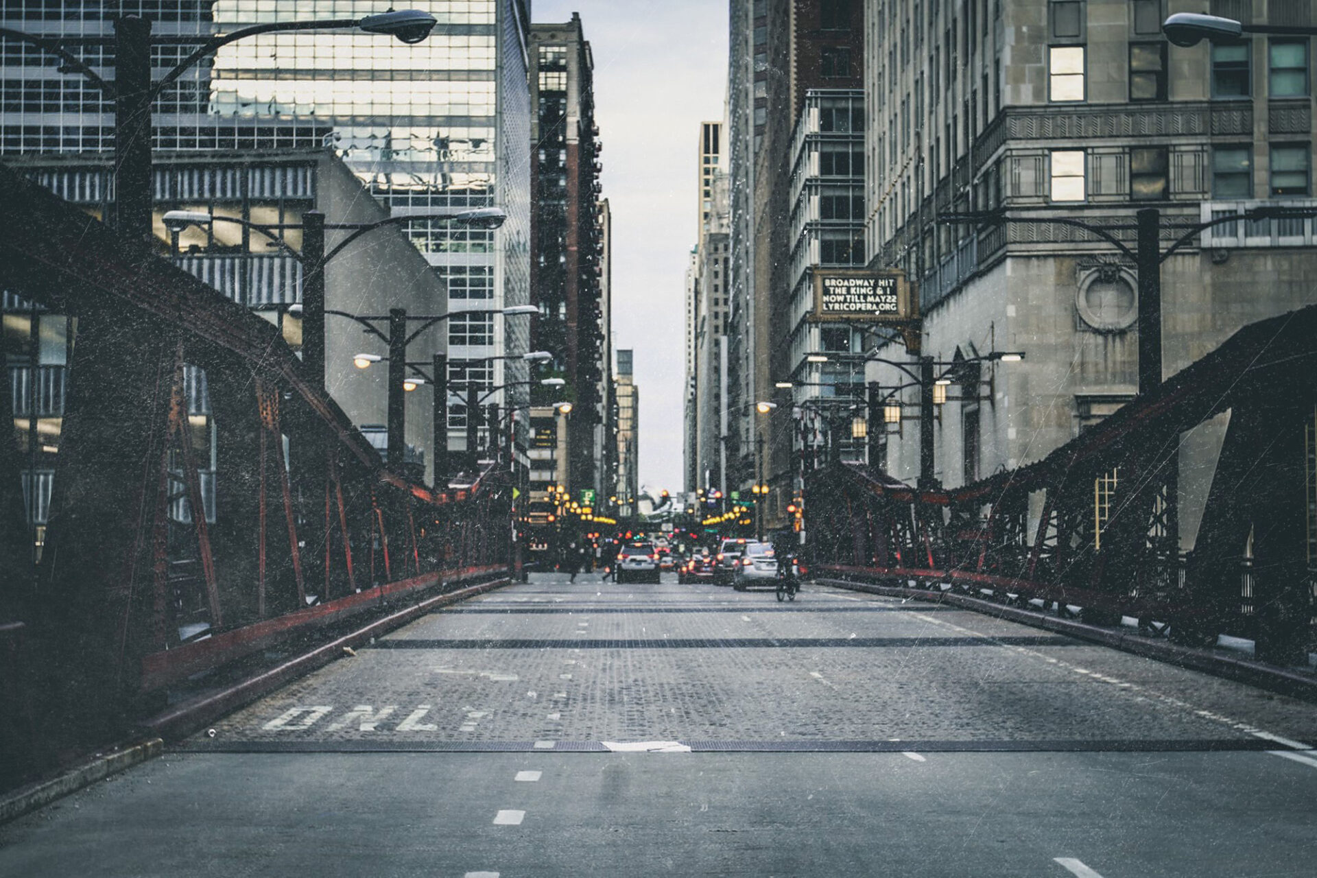 A city street with traffic lights and buildings