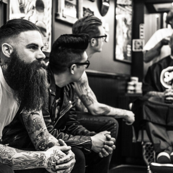 A group of men sitting next to each other.